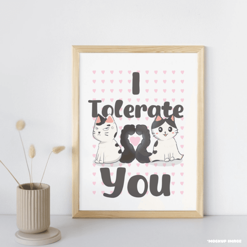 A mock up image of a print with two cats with the words I tolerate you