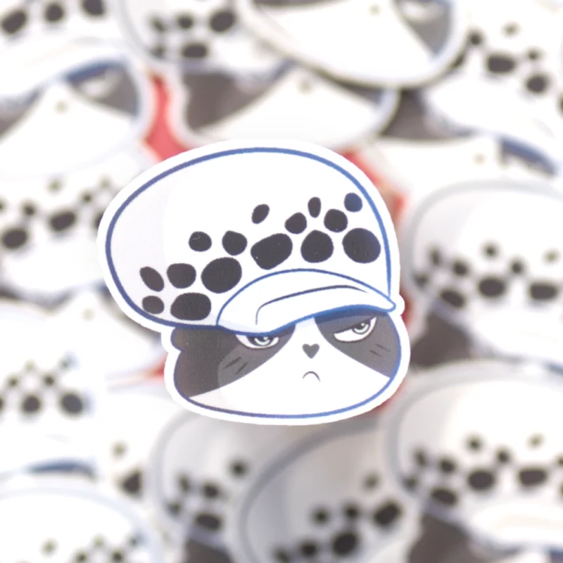 A bitter cat sticker that is inspired by Trafalgar D. Water Law in the manga One Piece.