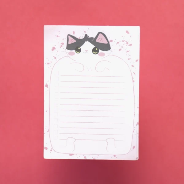 A top down picture of a to do list pad. A cartoon cat blesses the page with the list on its belly.