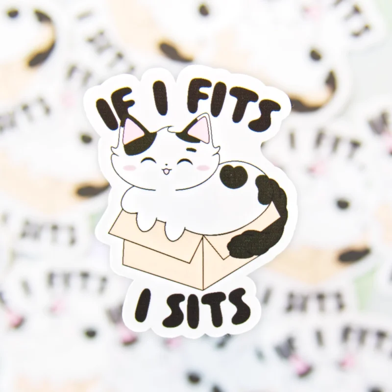 A sticker design of a cat in a box with the text if I fits, I sits.