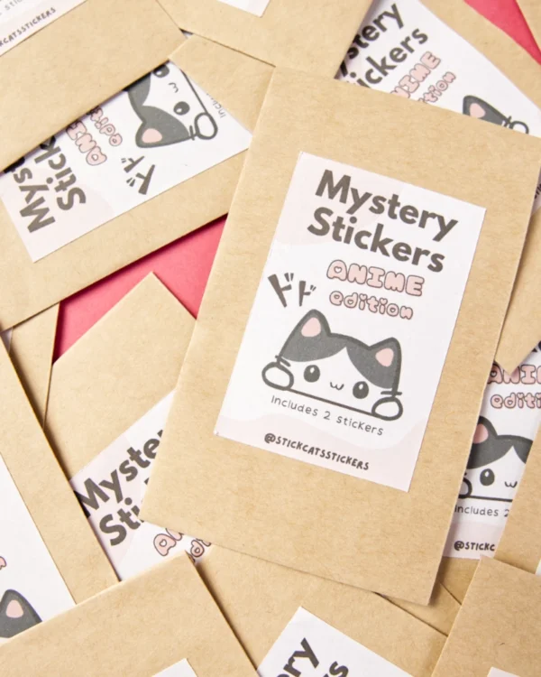 Several small bags with the label mystery stickers and a cute cat on it. Anime edition.