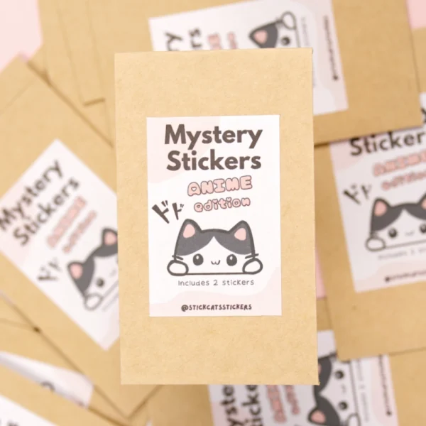 A close up of a paper bag with the words mystery stickers, anime edition with a cute cat on it.