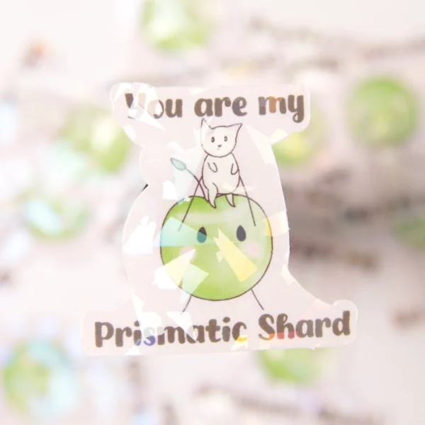 a close up on a junimo sticker with the words you are my prismatic shar