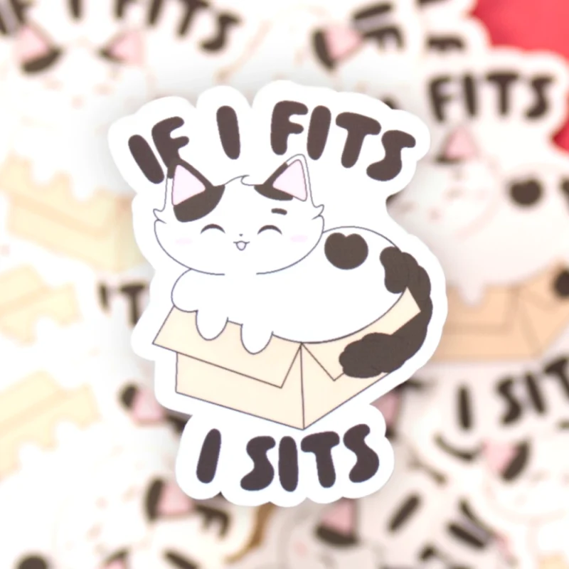 A sticker design of a cat in a box with the text if I fits, I sits.
